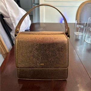 JW Pei gold purse